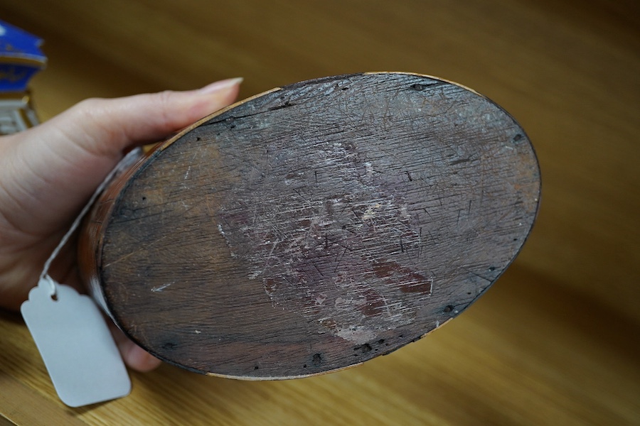 A George III oval satinwood and mahogany tea caddy, 15cm wide. Condition - poor